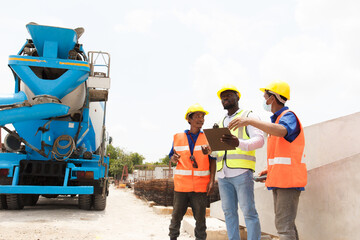 Group of contractors and engineer are discuss together at construction site.