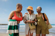 © BONNINSTUDIO/Stocksy - Senior friends enjoying a day at the beach