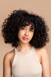 © mahalo studio/Stocksy - woman with curly hair portrait