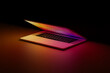 © Marcos Osorio/Stocksy - Illuminated laptop screen in dark room, concept of technology