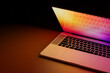 © Marcos Osorio/Stocksy - Illuminated laptop screen in dark room, concept of technology