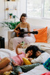 © BONNINSTUDIO/Stocksy - Best friends enjoying a music session at home