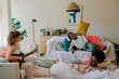 © BONNINSTUDIO/Stocksy - Best friends enjoying a cozy indoor gathering