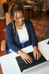 black woman working with laptop