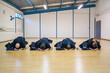 © Daniel Gonzalez/Stocksy - Kendo Practitioners Bowing in Dojo