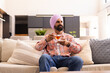 © Wavebreak Media - Relaxing on sofa, Indian man enjoying cup of tea at home