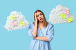 © Pixel-Shot - Excited young woman and sticky notes on clouds against blue background. Reminder concept