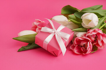 Wall Mural - Gift box and beautiful tulips on pink background
