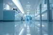 © Elmira - A low-angle shot of a hospital hallway with a reception desk in the foreground, showing the sterile environment