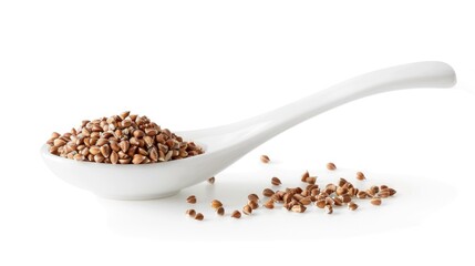 Wall Mural - High quality image of buckwheat groats in a white spoon on white background