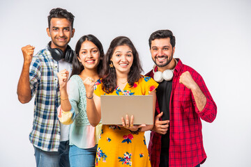 Wall Mural - Indian asian college students using laptop isolated against white background