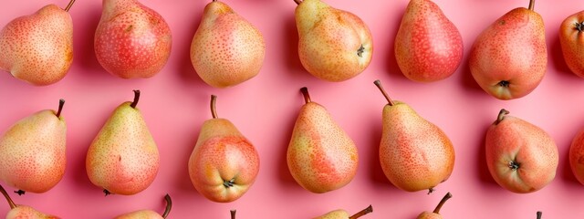 Wall Mural -  A collection of pears stacked on a pink surface before a pink backdrop