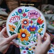 © klss777 - A Hungarian embroiderer meticulously creates vibrant floral patterns in the iconic Matyó embroidery.