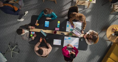 Aufkleber - Top View Shot: Diverse Entrepreneurs Sitting Around Conference Table In Tech Startup Office. Male and Female Colleagues Discussing Business Plan, Marketing, Using Laptop And Tablet Computer.