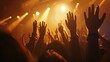 © Matcha_09 - People with hands raised high, illuminated by stage lights at concert