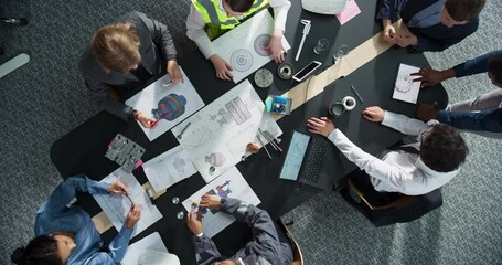 Aufkleber - Zoom Out Top Down View: Diverse Team of Business Professionals and Construction Engineers Working With Blueprints Of Industrial Machinery in An Office. Teamwork Of Colleagues With Laptop, Tablet