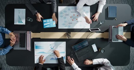 Aufkleber - Diverse Professionals Working on Business Statistics Reports and Digital Plans in an Office. Top Down View Of Discussion and Data Analysis on Laptops and Charts. Teamwork And Innovation Concept.