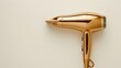 © pngking - Top view of a gold hair dryer on a white background with space for text