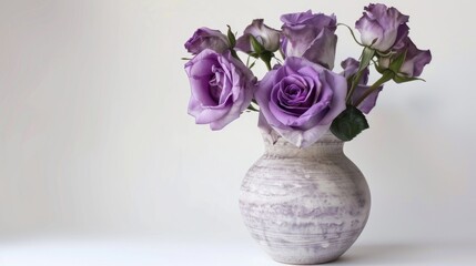 Wall Mural - Vintage vase holding purple roses on white background