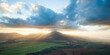 © AmazingAerialAgency - Aerial view of serene Waianae Sunset with majestic mountains, green fields, and picturesque sunset sky, Hawaii, United States.