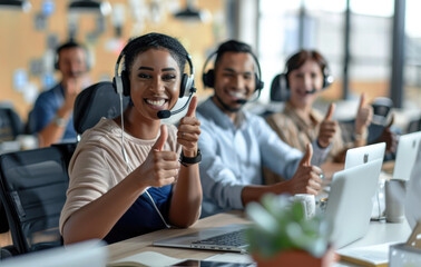Wall Mural - A group of happy and diverse people wearing headsets in front of their laptops, giving thumbs up and smiling at the camera against an office background in bright daylight