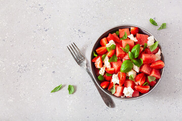 Wall Mural - watermelon salad with strawberry mozzarella cheese basil. healthy summer dessert