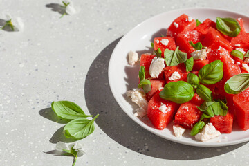 Wall Mural - watermelon salad with feta cheese and basil. healthy summer dessert