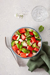 Wall Mural - watermelon salad with feta cheese, cucumber and basil. healthy summer dessert