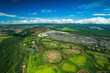 © AmazingAerialAgency - Aerial view of lush recreational area with Mililani Baseball Fields, tennis courts, and swimming pool, Mililani, Hawaii, United States.