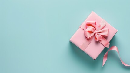 Sticker - Pink gift box with ribbon on light blue background Top view with space for text