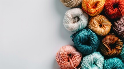 Assortment of yarn on white background with copy space
