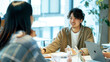 © bephoto - カジュアルな服装の若いビジネスウーマン オフィスで会議中