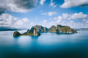 el nido, palawan, philippines. panoramic aerial view lonely tourist boat in open sea with exotic tro