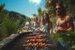 © Miha - Group of friends having grill and party outdoors. Friends socialising
