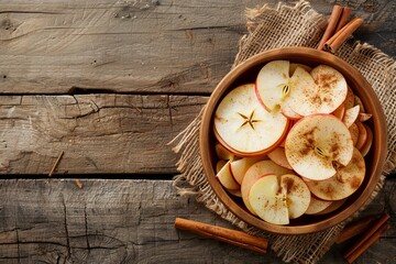 Poster - Healthy vegan apple cinnamon chips on rustic wood background for cooking or snacking