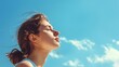 © Marco - beautiful white woman with closed eyes looking up with a beautiful blue sky background