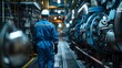 © horizon - A marine engineer in a blue overalls and safety helmet inspects the interior of a massive cargo ship's engine room. highlighting the intricate machinery and piping systems.