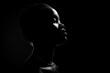 © SKIMP Art - A silhouette of the head and shoulders against a black background, with light coming from behind to create an outline of facial features Generative AI