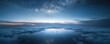 © narak0rn - Breathtaking view of a serene night sky with stars and clouds reflecting on calm water, evoking a sense of tranquility and wonder.