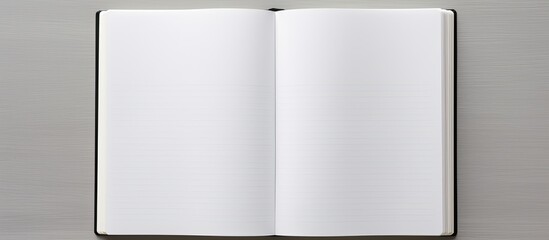 Leinwandbilder - Top view of an open blank notebook on a grey background, ideal as a mockup for design with copy space image.