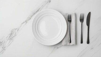 A white dinner plate sits on a marble tabletop with a cloth napkin beside it, along with two black forks and a knife