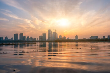 Wall Mural - Serene Sunset Over Modern City Skyline