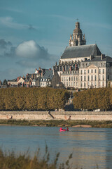 Wall Mural - A serene day on the loire river with tours cathedral in the background