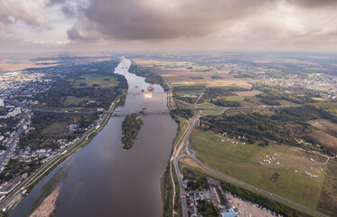 Wall Mural - A rivers embrace: aerial view of a french cityscape