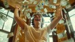 © Pure Imagination - Man celebrating with money raining down