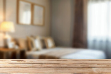 Poster - Empty wooden table in a cozy bedroom, bathed in natural light, perfect for showcasing products or advertising.