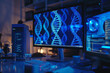 © mila103 - A computer monitor displays a DNA strand on a blue background