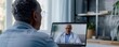 © Kasitthanin - A senior man has a telehealth appointment with his doctor.