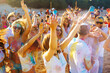 © maxbelchenko - Holi festival. Group of friends having fun at the beach party. Friendship, rest, holidays.