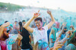 © maxbelchenko - Holi festival. Group of friends having fun at the beach party. Friendship, rest, holidays.